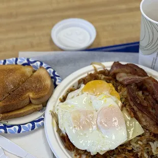 More hashbrowns than I know what to do with, lightly buttered toast and semi-crispy bacon.