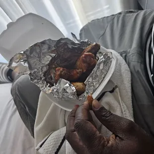 a person holding a plate of food