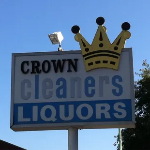 a sign for crown cleaners liquors