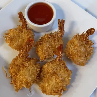 Crisp Coconut Shrimp. Shrimps coated in coconut flakes and fried to a delicious crisp.