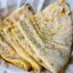 Cheese Naan. Flatbread with melted cheese filling baked in tandoori.