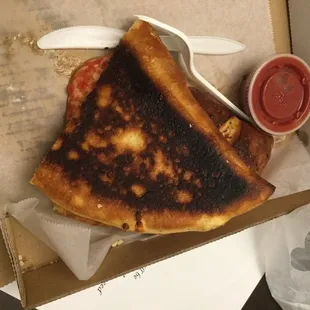 Burnt calzone. &quot;No, it&apos;s not burned, it&apos;s fresh dough.&quot;