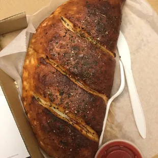 Burnt calzone. &quot;No, it&apos;s not burned, it&apos;s fresh dough.&quot;