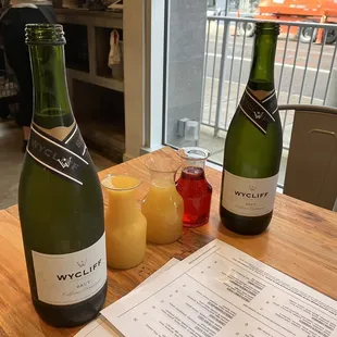 $15/person: you get your own bottle of champagne and orange juice/pineapple/cranberry mimosas