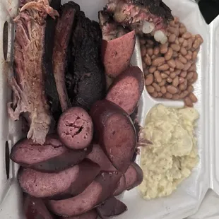 Two meat dinner with sausage and rib.