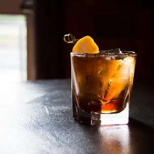 a drink in a glass on a table