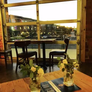two vases of flowers on a table