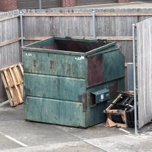 Maintenance throw stuff next to the dumpster and leave it. This particular trash has been sitting here for a week, since last Sunday.