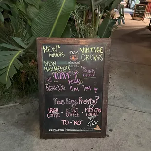 Sandwich board in front; note the mention of ownership change