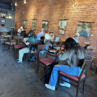a group of people sitting at tables