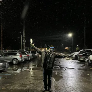 my dad posing outside the restaurant, he's a silly guy