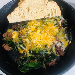 Custom burger meal with spinach peppers, onions, &amp; buttered toast