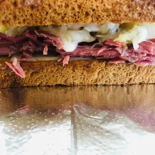 Reuben made with slow roasted Corned beef brisket, fresh kraut, Swiss cheese, &amp; housemade Russian dressing.