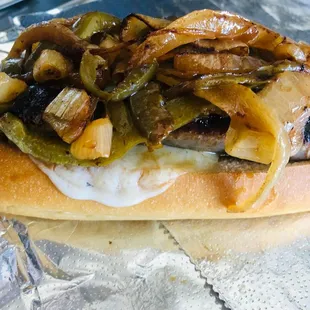Sausage sub with grilled onions, peppers, &amp; provolone.