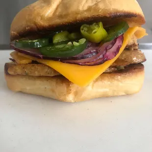 Custom sausage sub with peppered, and red onion.
