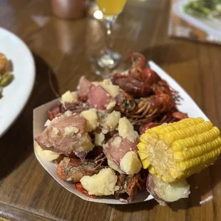 a plate of food and a glass of beer