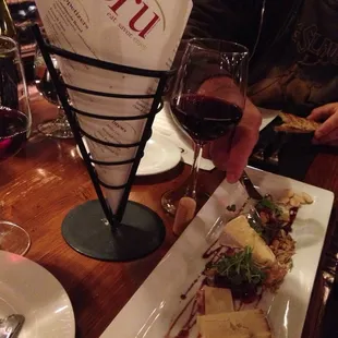 Trio of cheeses with Marcona almonds, dried cranberries, pepitos, micro greens and aged balsamic.