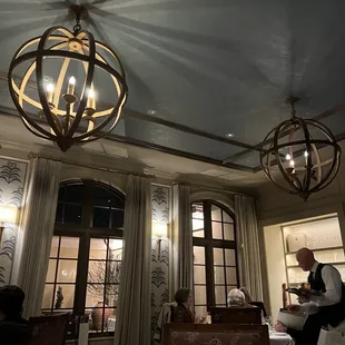 a restaurant with a chandelier