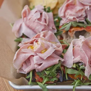 Pizza al taglio :: Housemade ham, arugula, tomato &amp; mozzarella