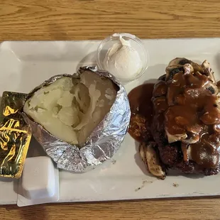 Chopped steak w/mushroom gravy and baked potato.