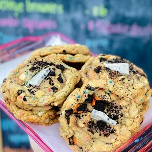 a person holding a tray of cookies