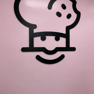 a chef's hat on the wall