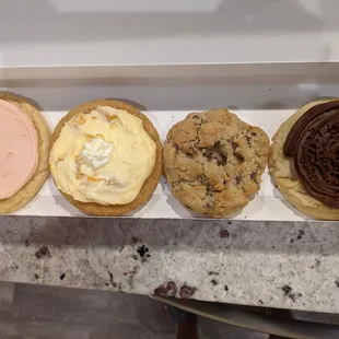 Sugar, peaches and cream, milk chocolate chip and chocolate cupcake cookies.