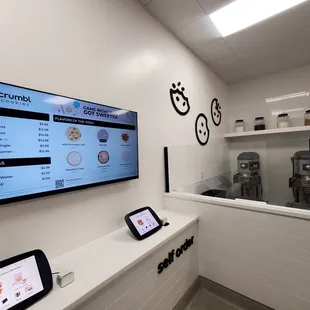 a digital menu on the wall