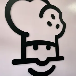 a chef's hat and mustache