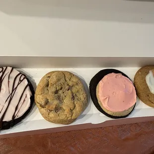 Chocolate with raspberry frosting, milk chocolate chip, Neapolitan, vanilla glaze with Cinnamon Toast Crunch