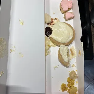 The next morning the aftermath of 4 cookies that were shared no one finished a single cookie cause how disgusting they were.