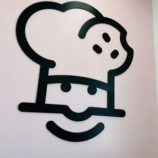 a chef's face on the wall