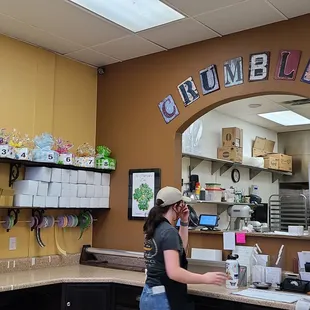 a woman standing at a counter