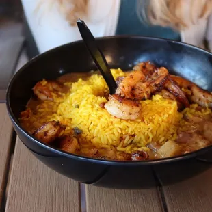 a bowl of rice and meat