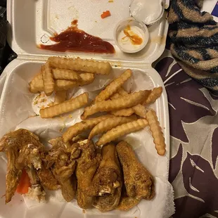 a meal in a styrofoam container