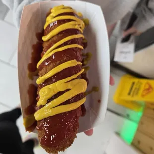 Original corndog with ketchup and mustard