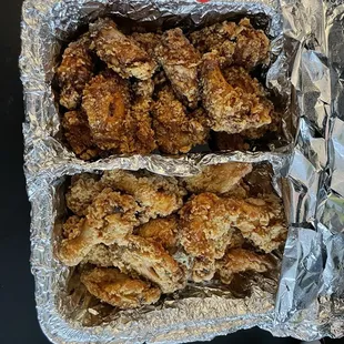 two trays of fried chicken