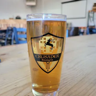 a glass of beer on a table