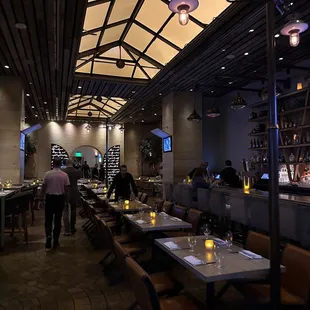 a view of a restaurant with tables and chairs
