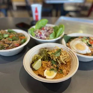 Our 3 dishes and appetizer  Yum Gai Chicken Lettuce Wraps,  Phat Ke Mao Drunken Noodles, Khao Phat Thai Fried Rice, Khao Soi