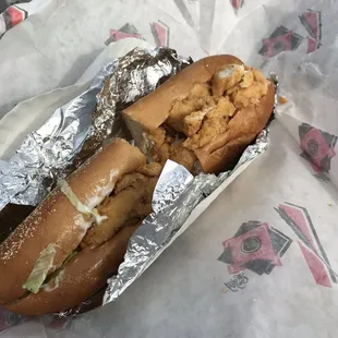 a hot dog in a foil wrapper