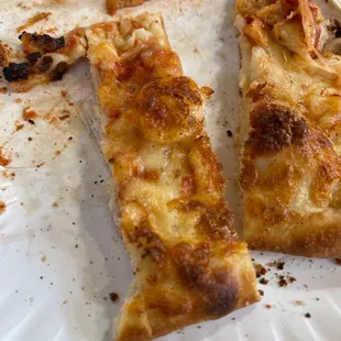 Yummy cheese pizza already made by the slice heat and eat.
