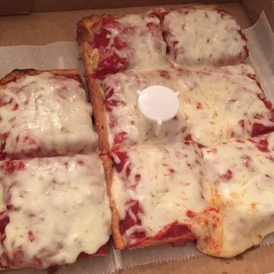 Thick square with freshly grated provolone. I love it!