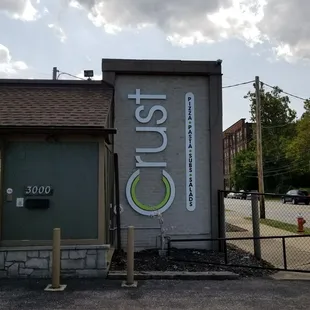 the front of a building with a sign on it