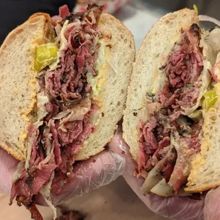 CRUST HOT PASTRAMI - Double Pastrami, melted cheese, pepperoncini, lettuce, onions, spread. Exclusively at CRUST San Jose