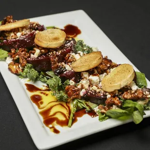 a plate of food on a black table