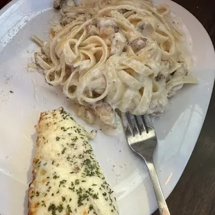 Chicken Fettuccine Alfredo, comes with cheesy bread.