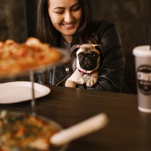 a woman and a pug