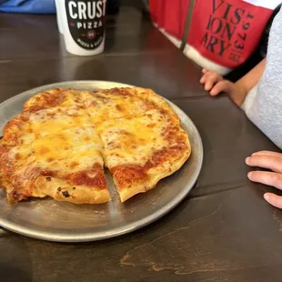 Kids pizza. For the price, you get a better deal by choosing the cheese sticks. Much bigger for a little bit more