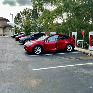 Charging up at the Tesla Supercharging Station nearby.